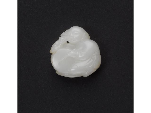 An almost white jade of a boy beating a drum;