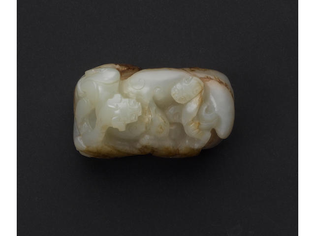 A mottled pale celadon jade [possibly a scroll weight]