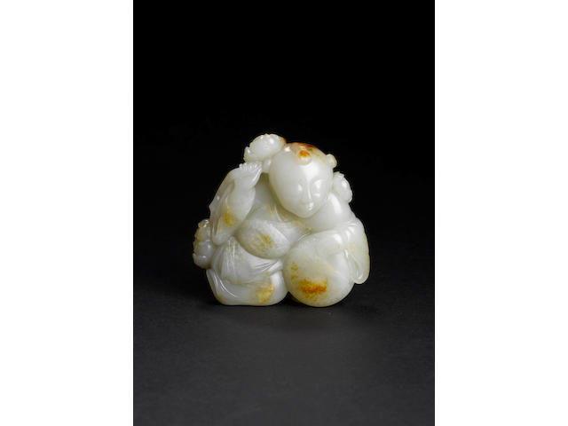 A rare white and russet jade 'boy and drum' carving 18th century