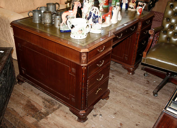 A reproduction mahogany twin pedestal partners desk,