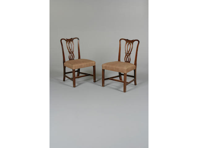 A set of eighteen George III style mahogany dining chairs by Maple and Co. after a design by John Linnell