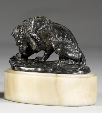 After Antoine-Louis Barye (French 1795-1875): A bronze of a lion and serpent No.2