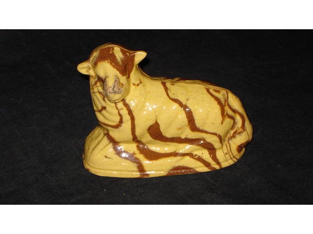 An agate ware figure of a recumbent sheep