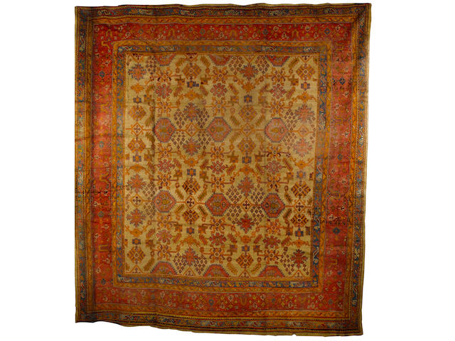 An Ushak carpet West Anatolia, 14 ft 9 in x 13 ft 7 in(450 x 414 cm) some minor losses and minor wear