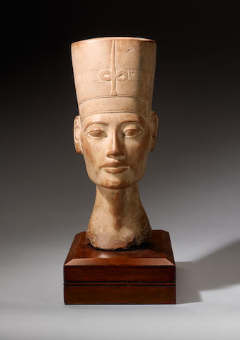An Egyptian Revival carved stone head of Nefertiti