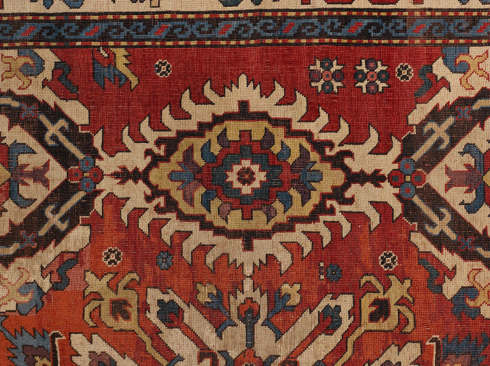 A late 18th early 19th century Karabagh carpet South Caucasus, 11 ft 11 in x 6 ft 6 in (363 x 198 cm),old restorations