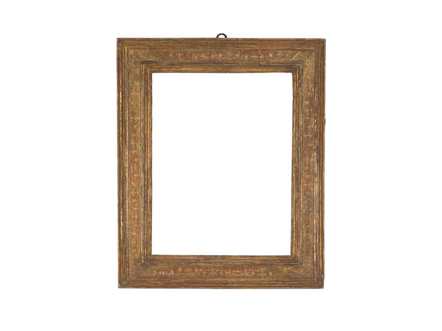 An Italian 17th Century carved and gilded cassetta frame