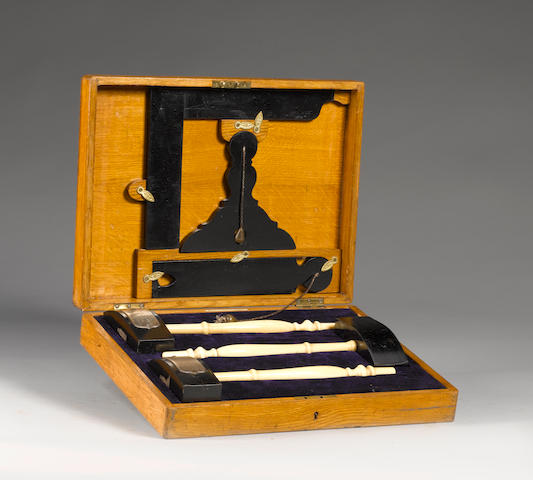 A late 19th century cased set of ebony and ivory Masonic working tools