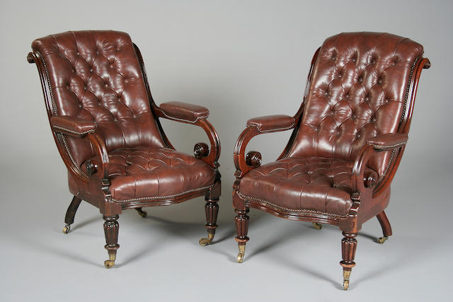 A pair of William IV leather upholstered mahogany armchairs