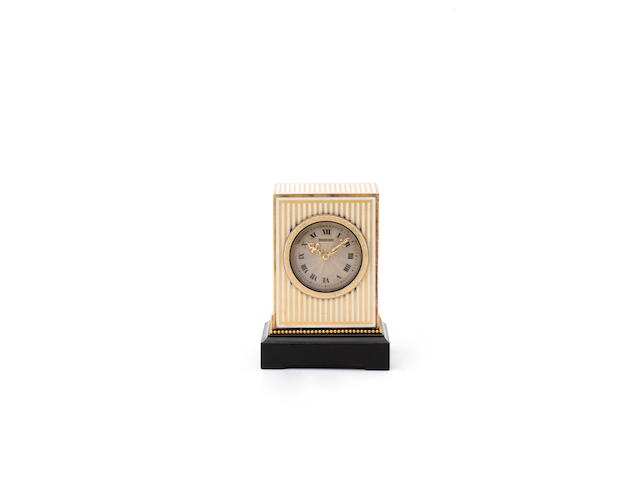 An early 20th century gilt and enamel miniature timepiece The case numbered 709 to the winding shutter