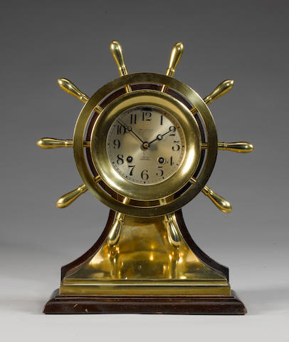 A brass watch-striking clock 10x5x14in(25x13x36cm)