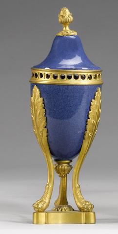 A pair of late 19th / early 20th century gilt bronze mounted Sevres style powder blue porcelain vases
