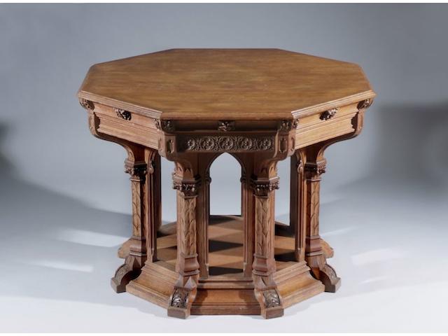A late Vicorian carved golden oak Gothic revial octagonal centre table