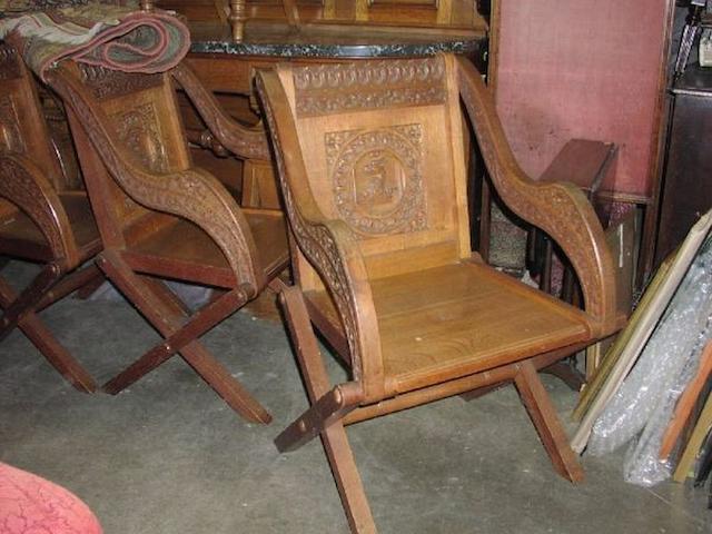 A set of four late Victorian matching oak Glastonbury chairs