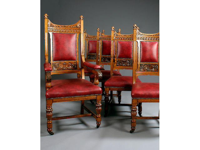 A set of twenty late Victorian carved oak dining chairs