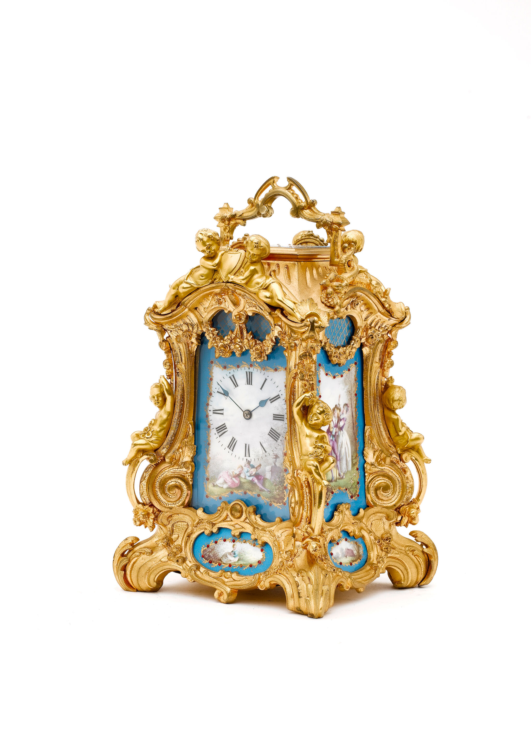 A late 19th century French porcelain mounted brass carriage cloc