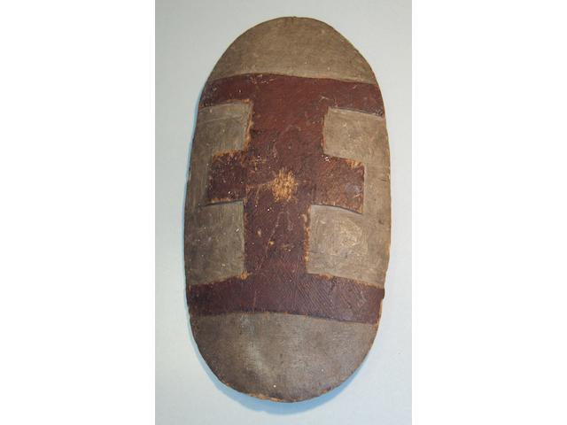 An Aboriginal carved oval wood shield, Queensland 54 x 28cm