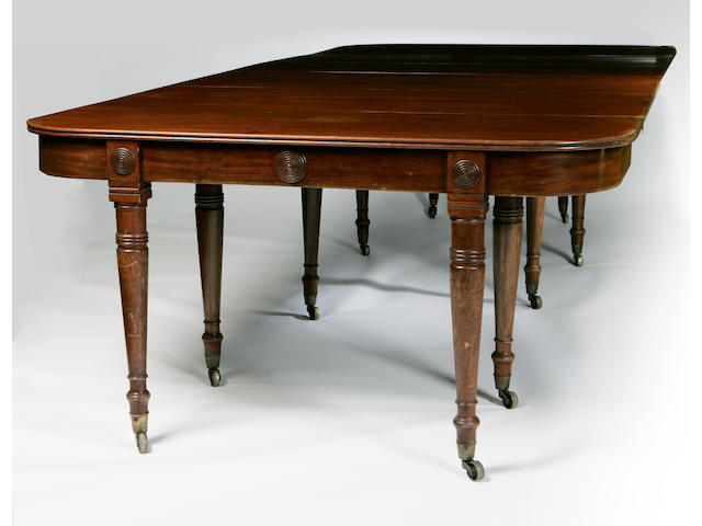 A George IV mahogany 'concertina action' dining table with five leaves