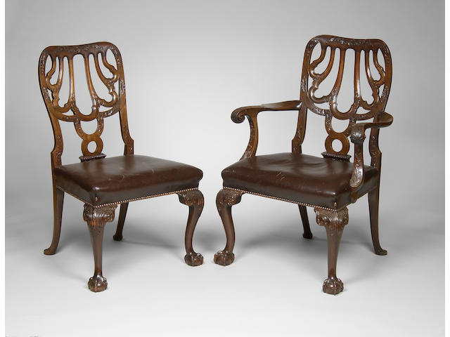 A good set of eight George II style carved mahogany dining chairs in the manner of Giles Grendey