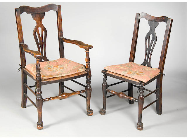 A set of eleven early 20th century oak dining chairs