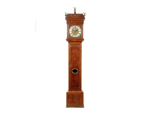 An early 18th century walnut and seaweed-marquetry cased quarter chiming longcase clock Alex. Irving, London