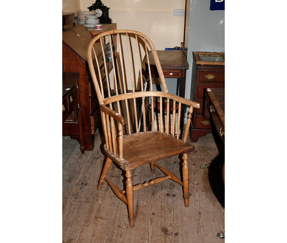 An early 19th century ash hoop and stickback armchair,