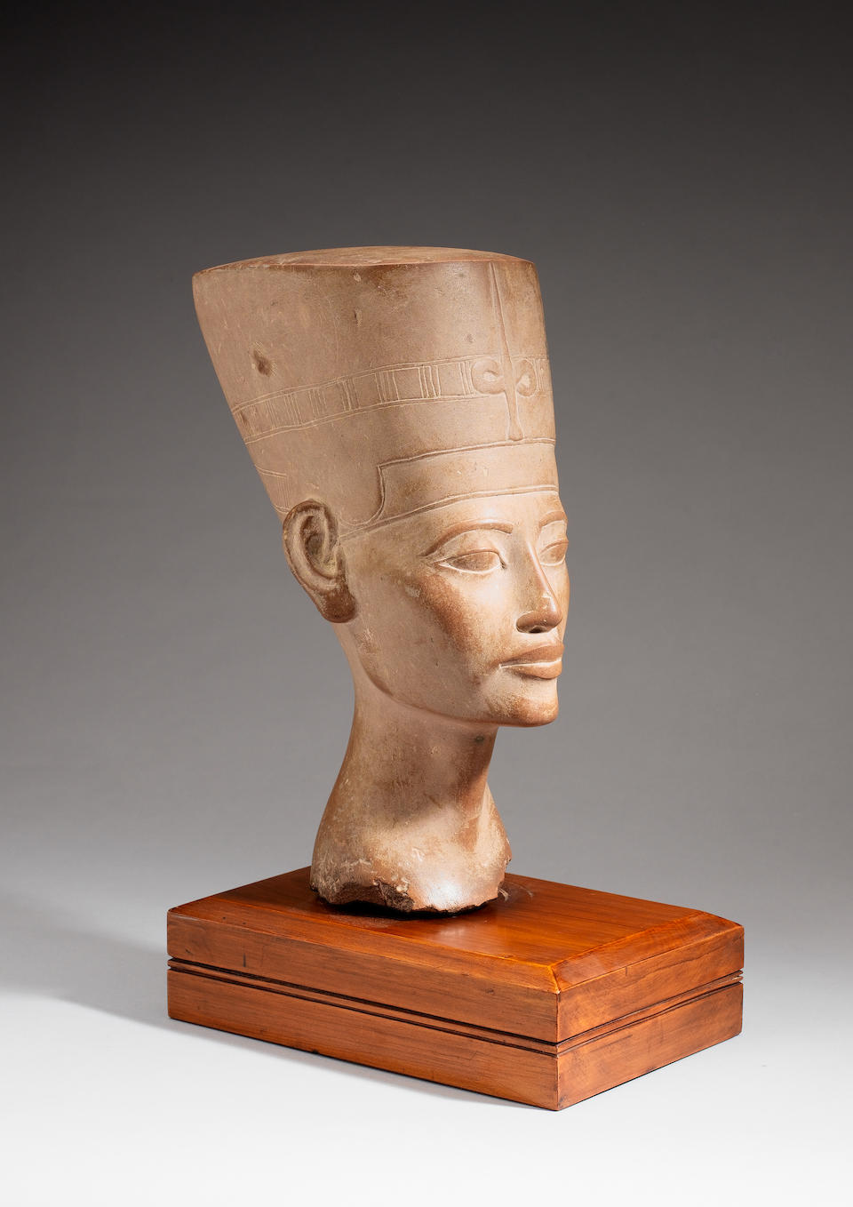 A late 19th century carved stone head of Nefertiti