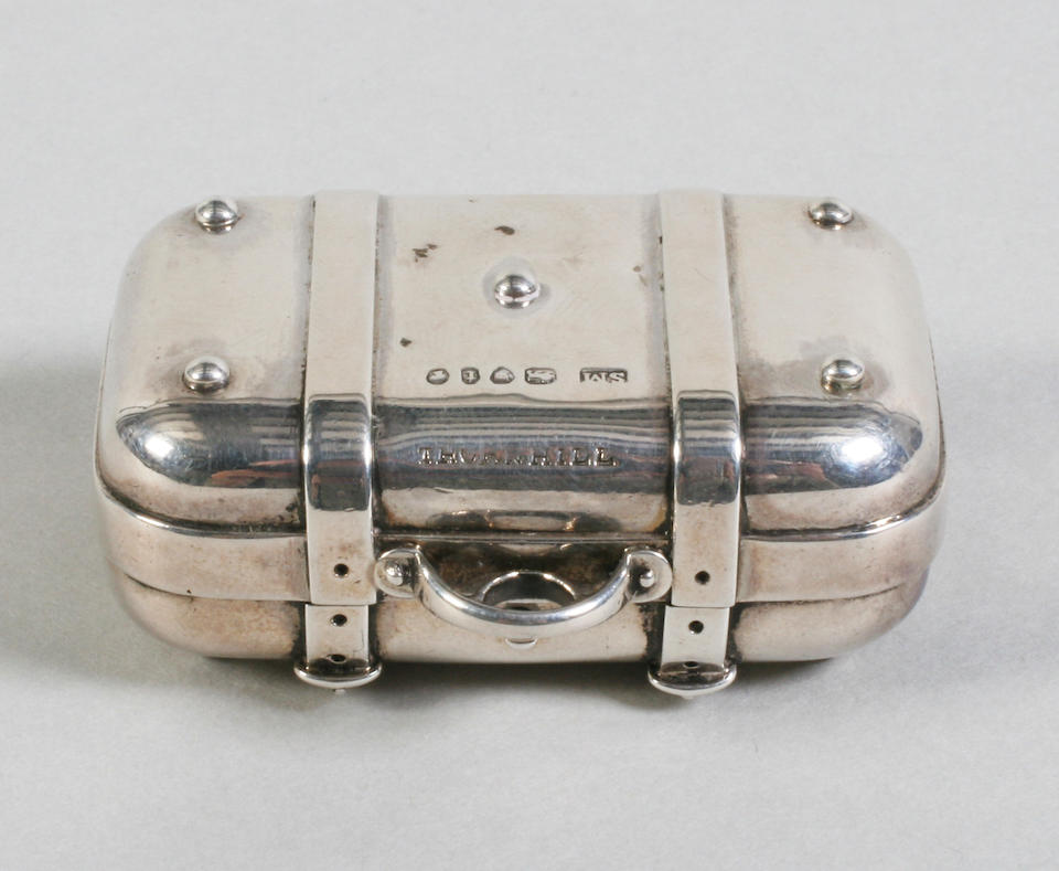 A Victorian silver sewing companion in the form of a suitcase with securing straps