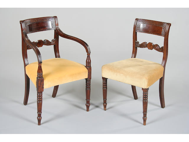 A set of seven late Regency mahogany dining chairs