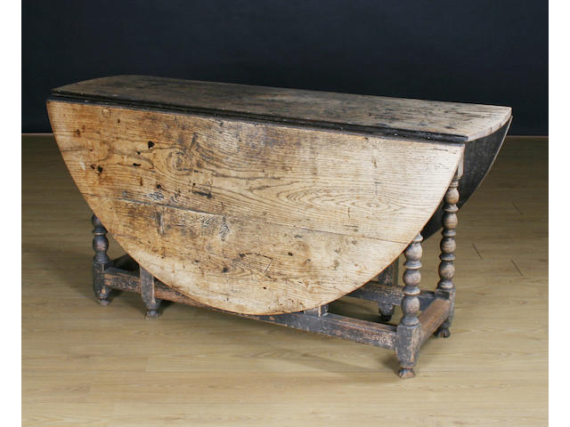 A 17th Century oak gateleg dining table