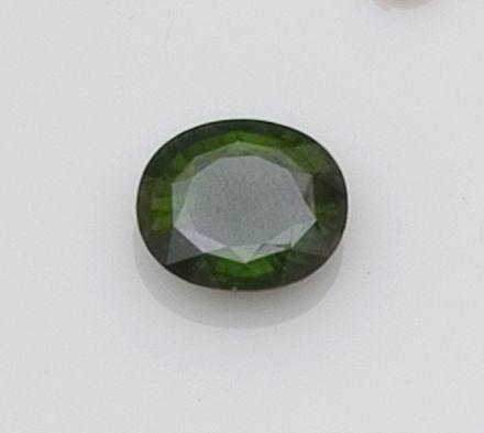 An unmounted green sapphire