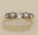 A pearl and diamond ring