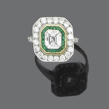 A diamond and emerald ring