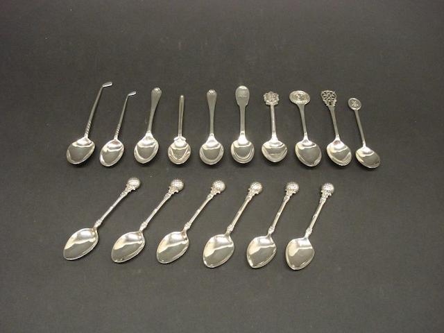 A collection of silver golfing spoons