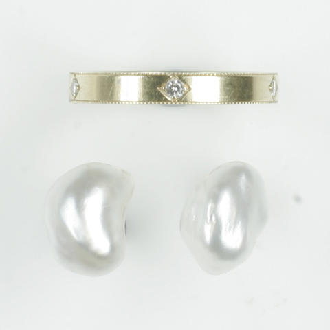 A gold and diamond ring and a pair of pearl earstuds