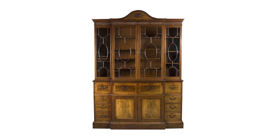 A fine George III mahogany and inlaid breakfront bookcase in the style of Gillow, presented by His Majesty George III to his lawyer Peter Still