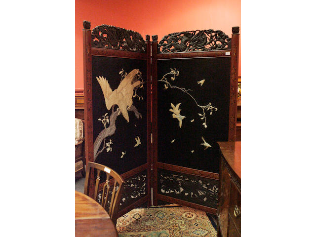 A Japanese two-fold black lacquer and ivory floor screen 19th century