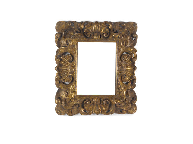 A Florentine 17th Century carved, pierced and gilded frame