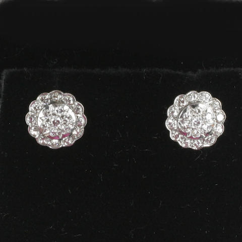 A pair of diamond cluster earrings