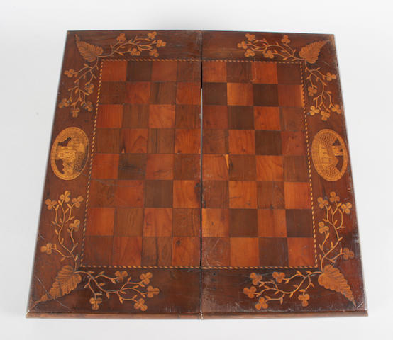 A mid-19th century Irish arbutus and yew veneered and boxwood inlaid chess and backgammon board/box