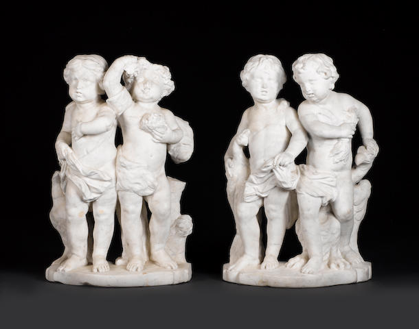 Dutch, early 18th century A pair of white marble figural groups of putti