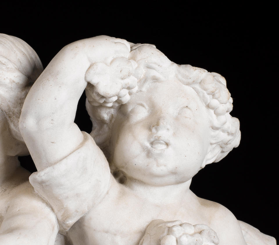 Dutch, early 18th century A pair of white marble figural groups of putti