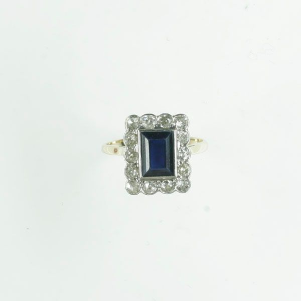 A sapphire and diamond rectangular cluster panel ring