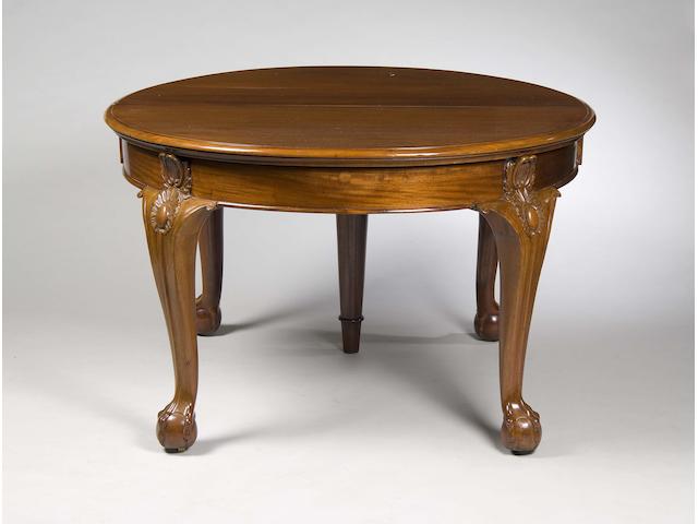 An oval mahogany extending dining table