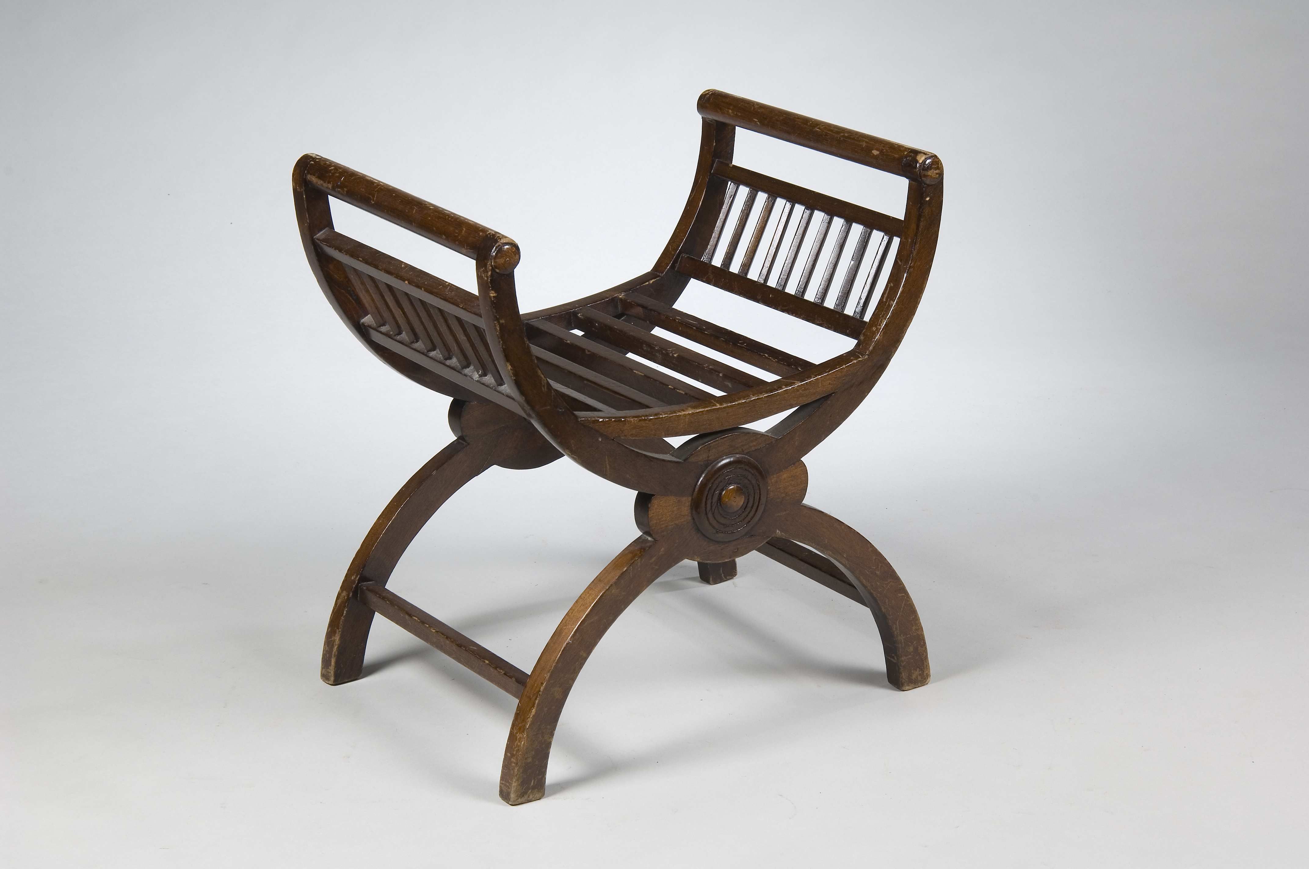 A stained beech X frame stool