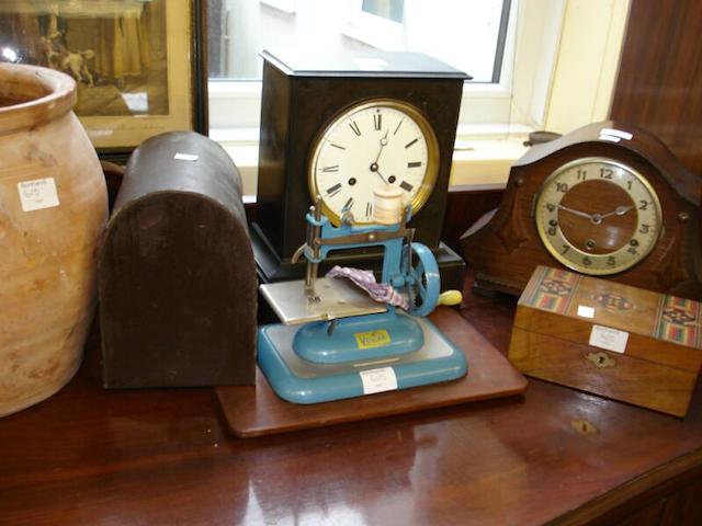A late Victorian black slate mantel clock,