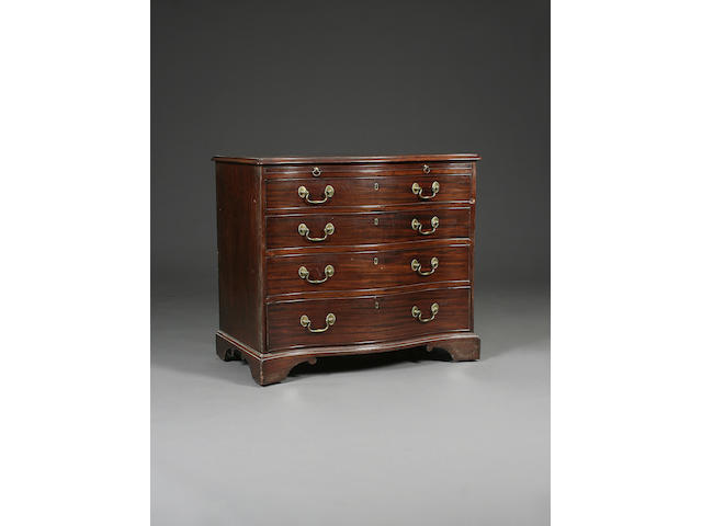 A George III mahogany serpentine front chest of drawers