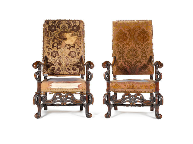 A pair of large William and Mary style carved walnut Open Armchairs