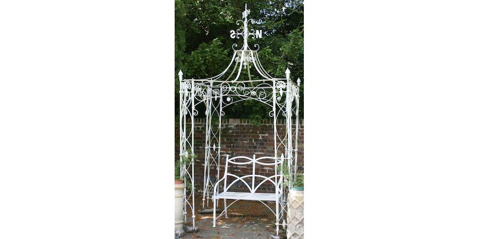 An early 20th century white painted cast and wrought iron gazebo