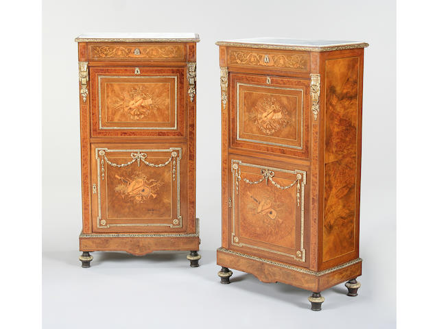 A pair of 19th century figured walnut, amboyna, amaranth, and marquetry secretaires a abbatant